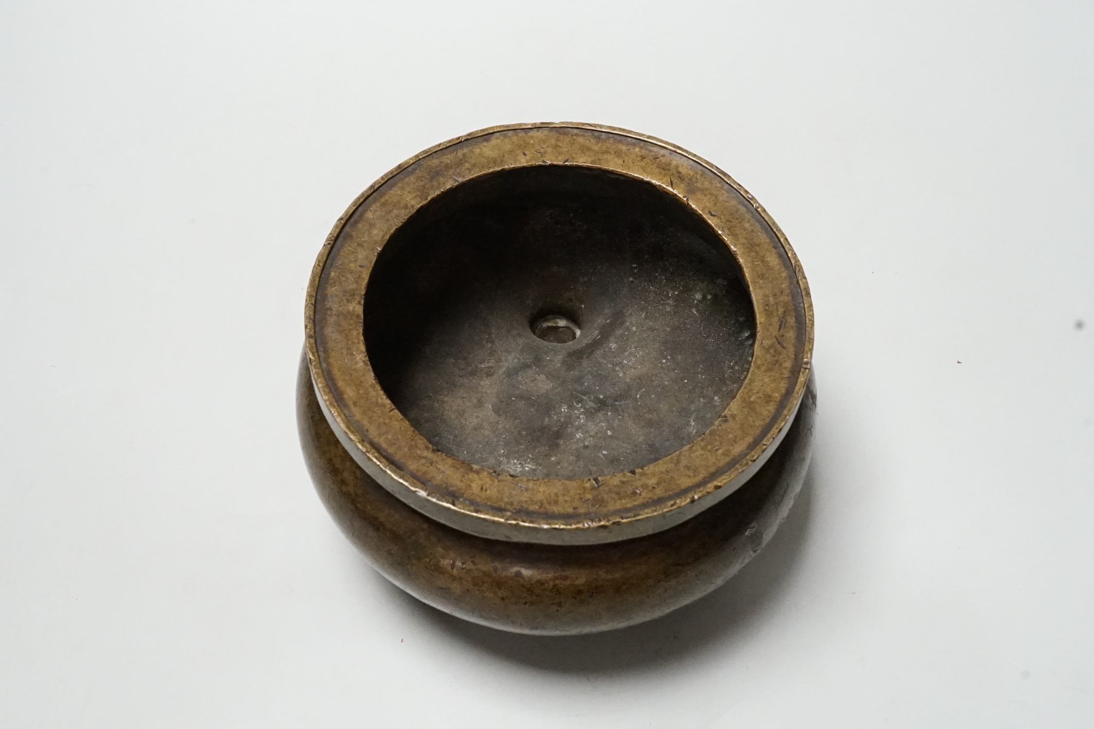 A Chinese bronze censer, ding, 14cm diameter